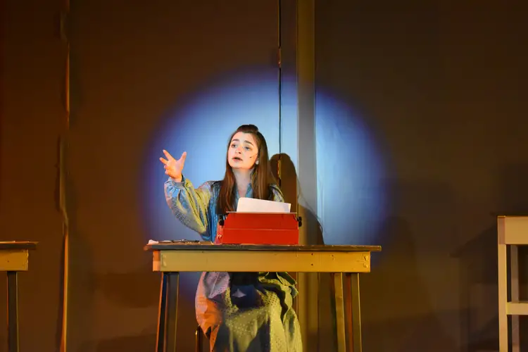 Abby performing on stage.